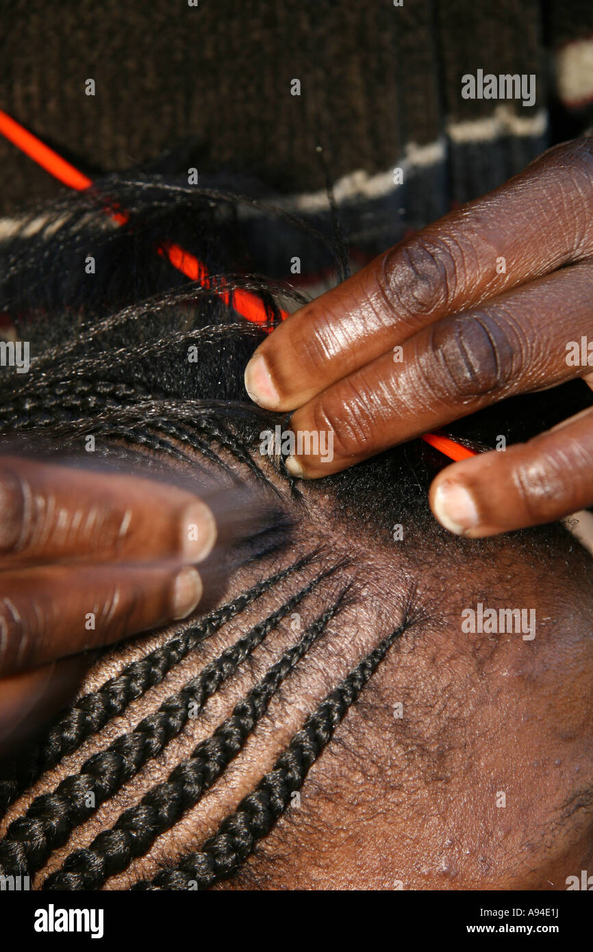 Hairdresser working on a new hair style Gaborone Botswana Stock Photo
