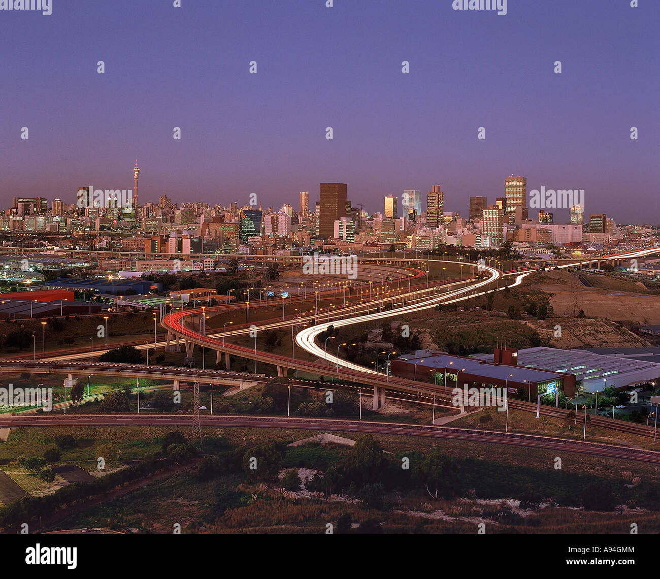 A view of Johannesburg city skyline at dusk showing the main highways and tall buildings and