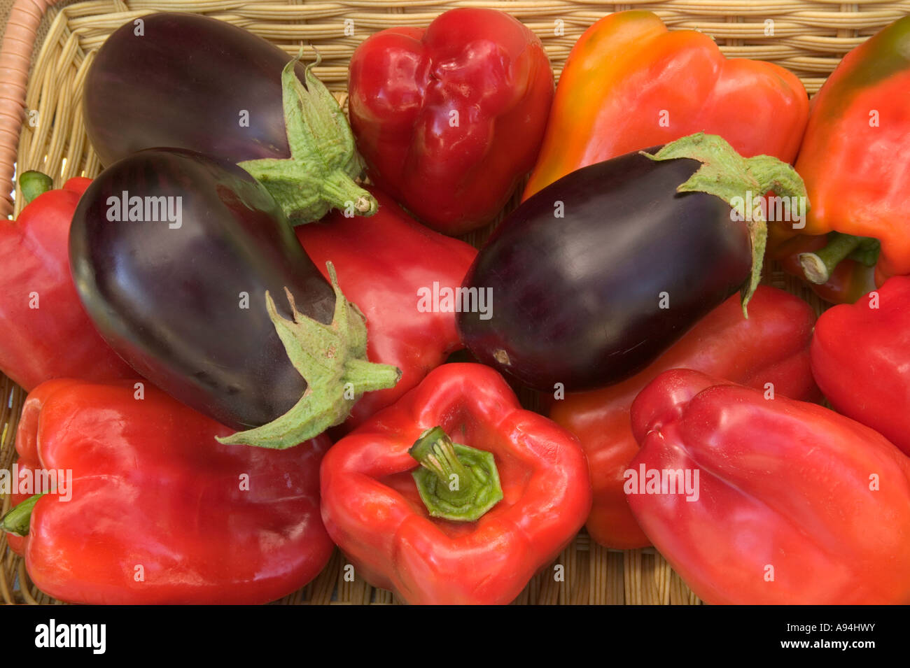 Sweet Red Bell Peppers, & eggplant, farmer's market. Stock Photo