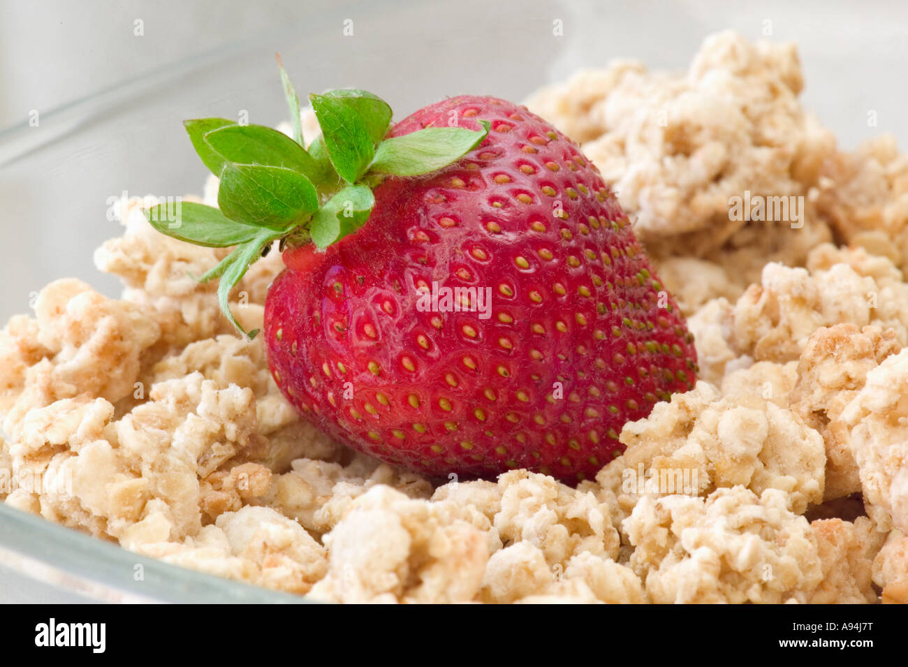 Strawberry with granola, a breakfast cereal Stock Photo Alamy