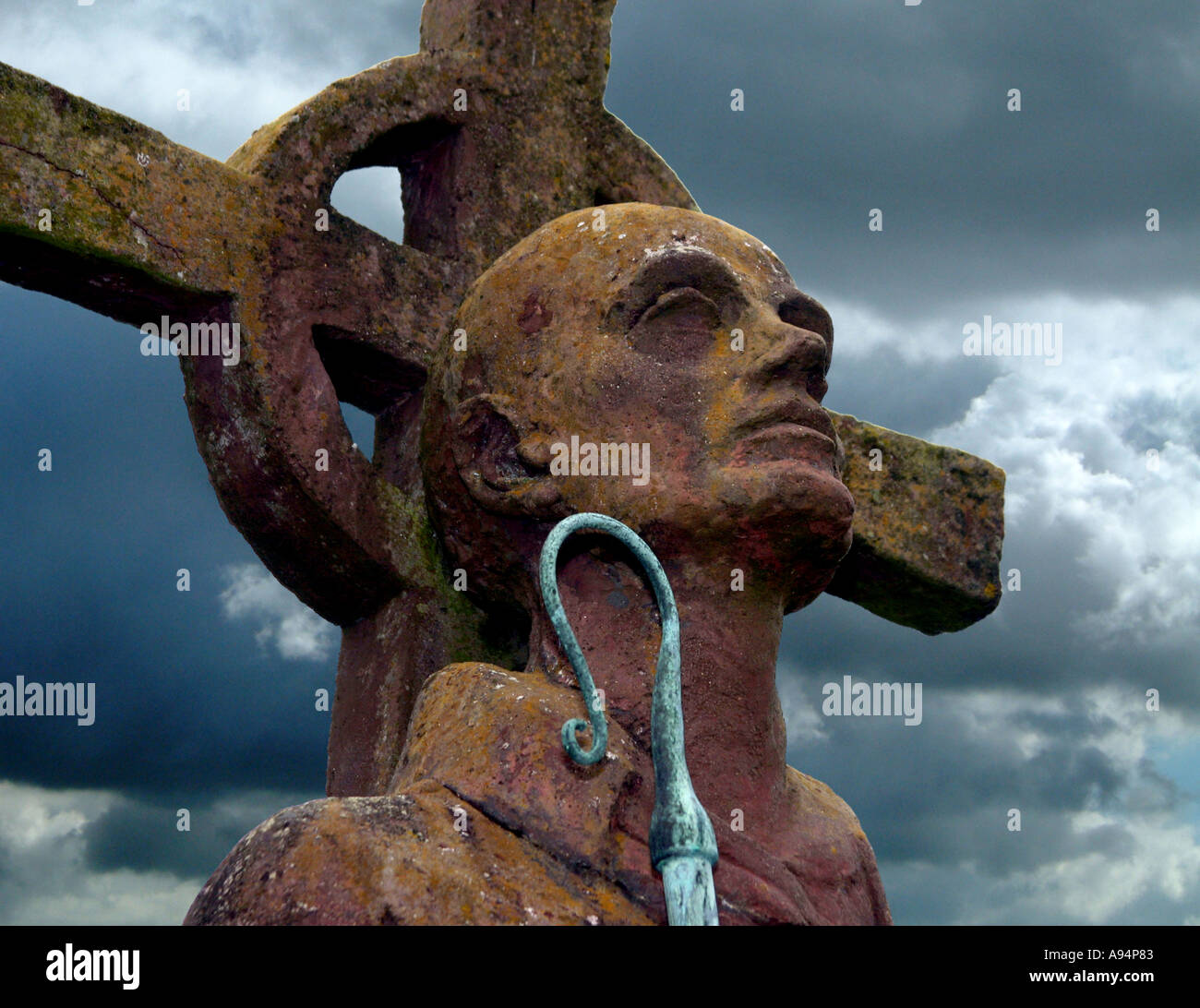 Head of statue of Saint Cuthbert in the ruined priory and church grounds at Lindisfarne Holy Island Stock Photo