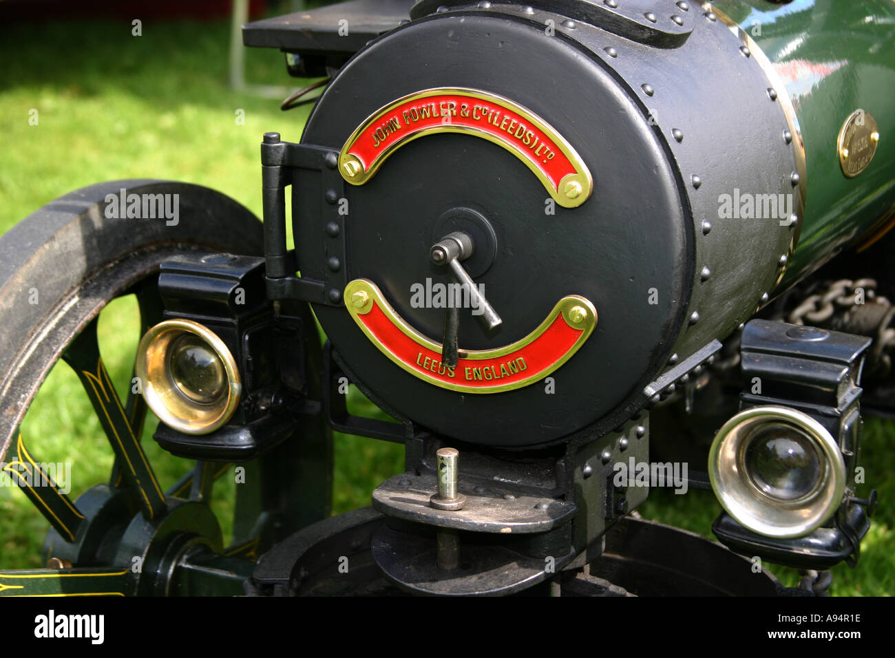 Front of a model traction engine with boiler cover showing motif for John Fowler Leeds Stock Photo