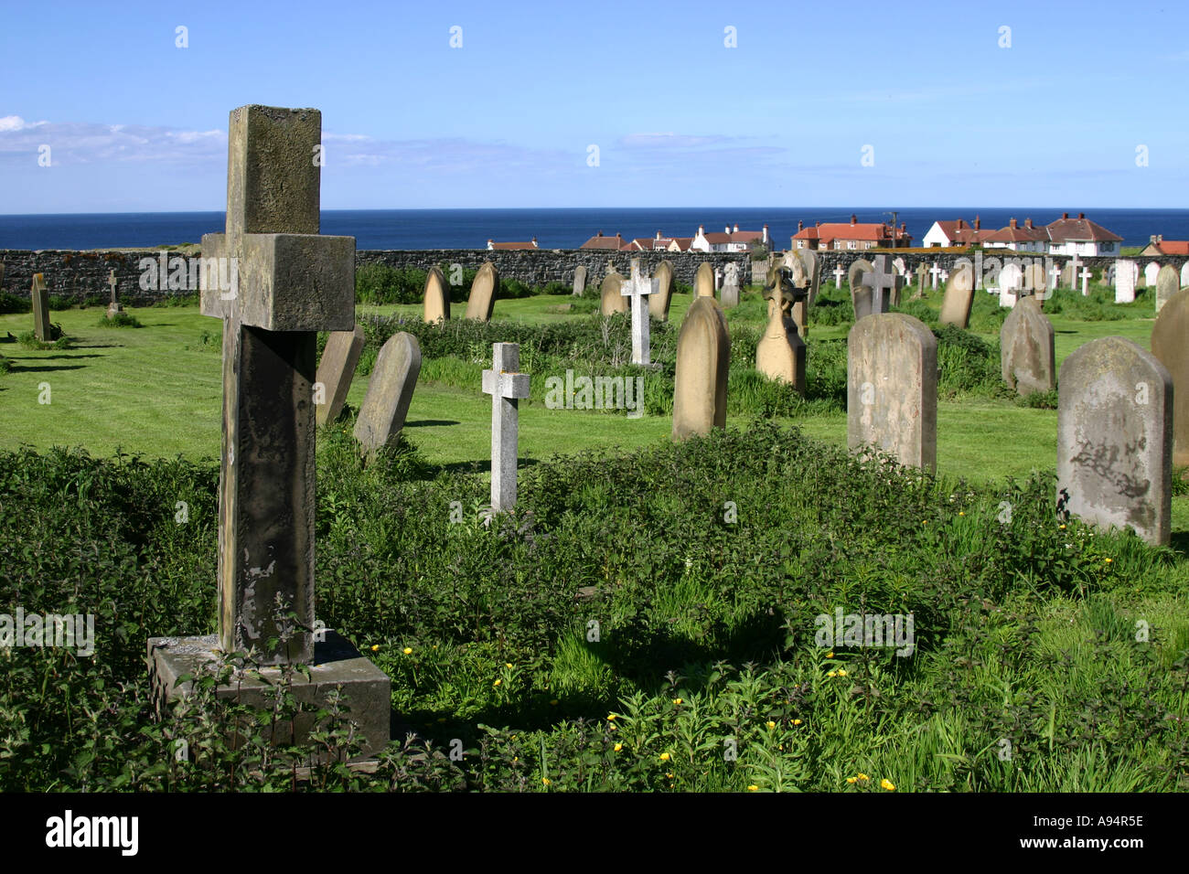 Graveyard of the church of saint Aidan in Bamburgh Stock Photo