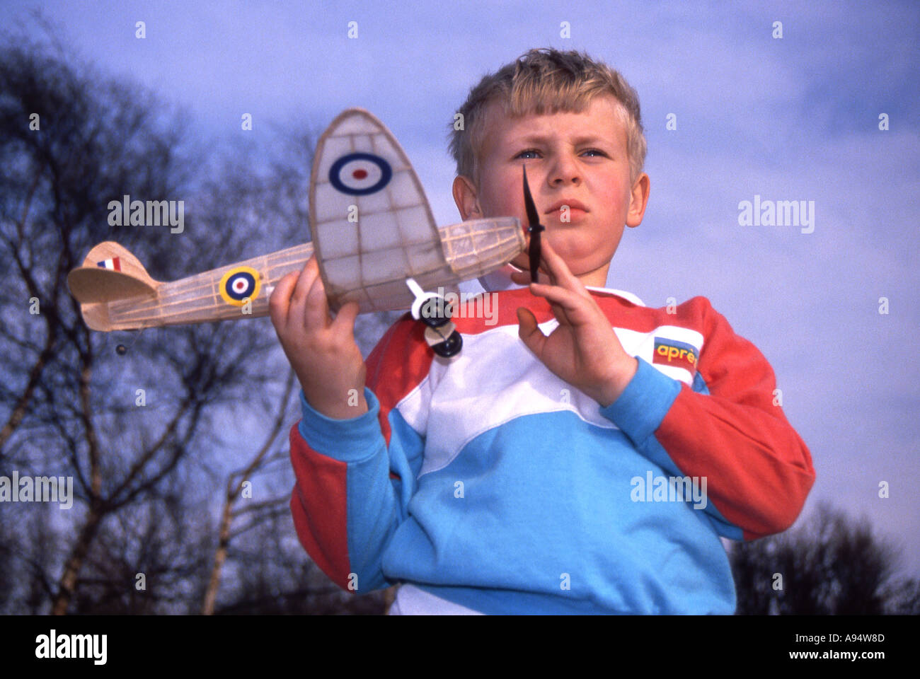 Young lad with model of Spitfire ready for a test flight Stock Photo