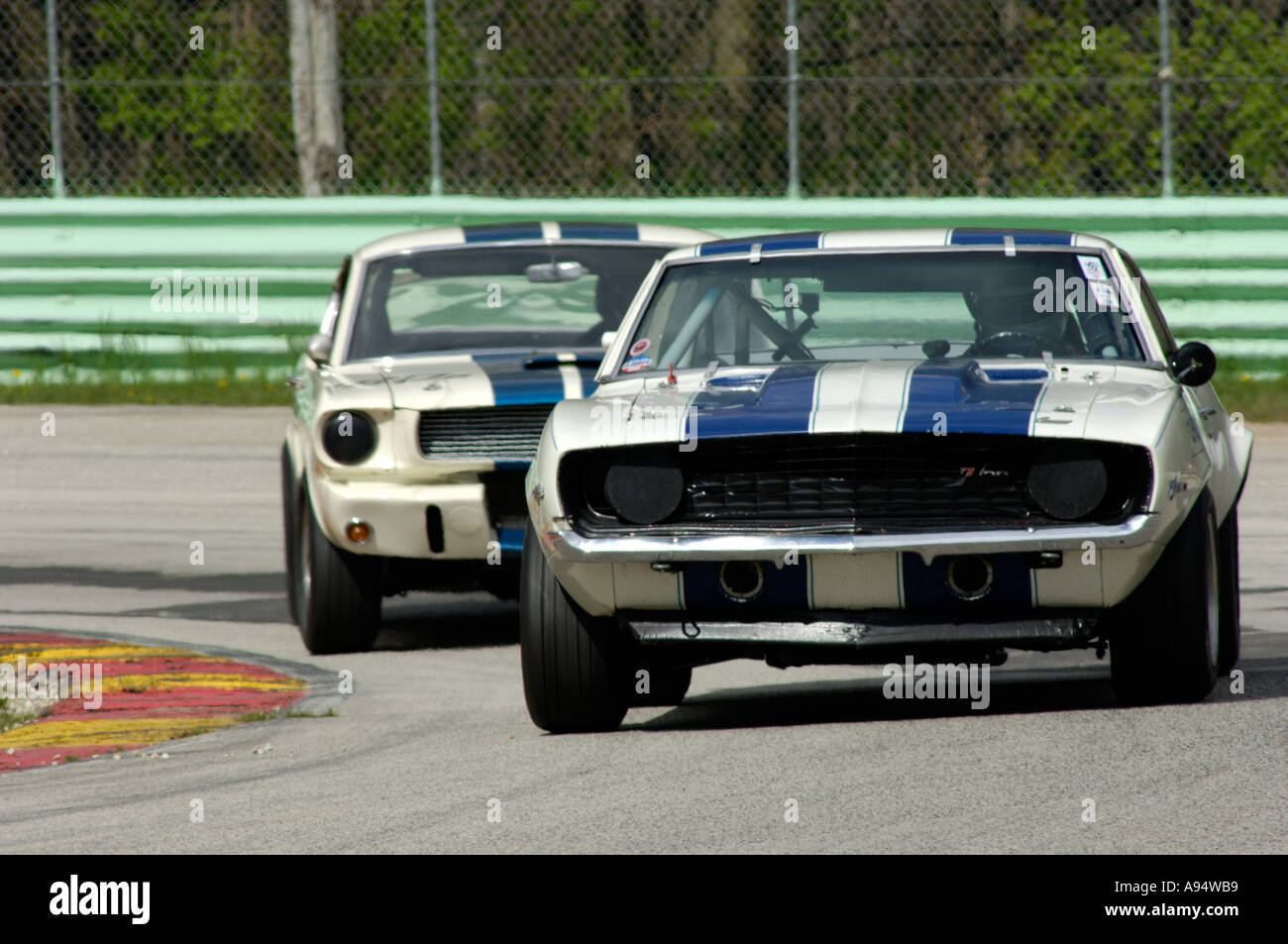 Sam Viviano in his 1969 Camaro Z 28 leads Curt Vogt in his 1966 GT350 at the Vintage GT Challenge at Road America 2005 Stock Photo