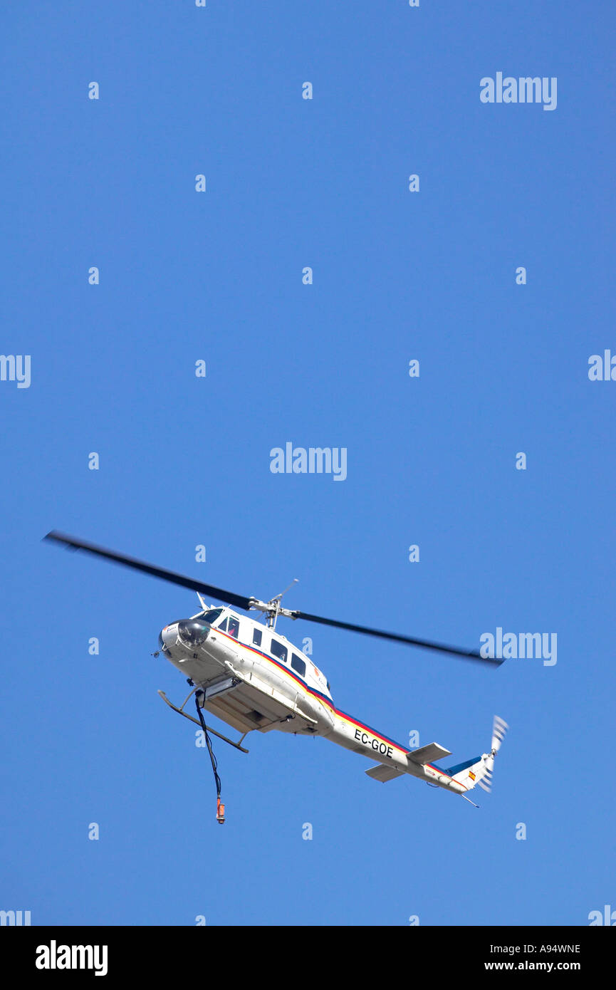 Helicopter water bomber drenching a forest fire Stock Photo Alamy