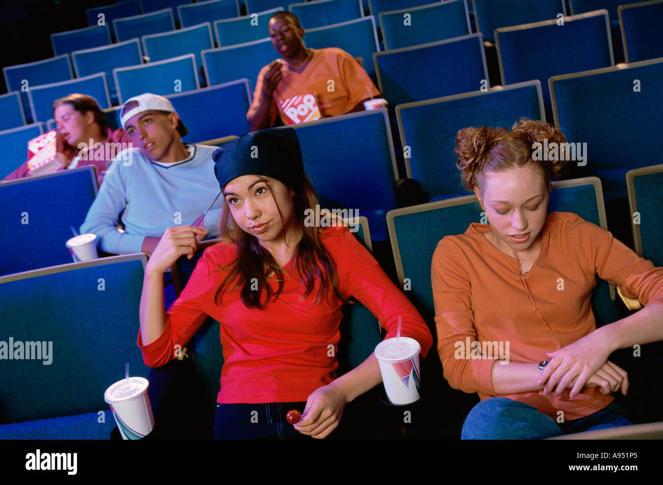 High angle view of two teenage girls sitting in a movie theater Stock ...