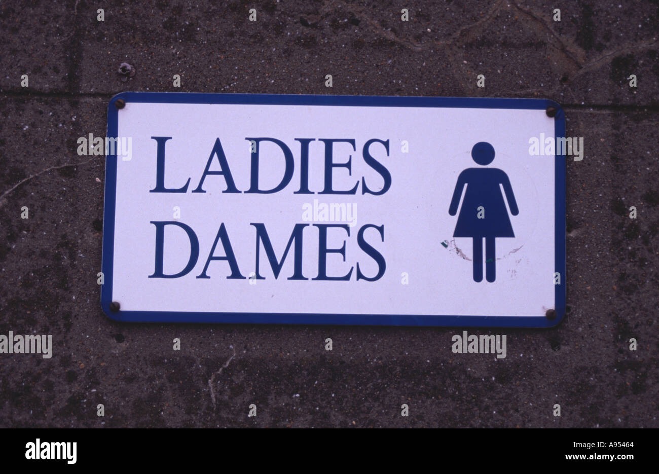 Ladies Public Lavatory Sign in English and French Stock Photo