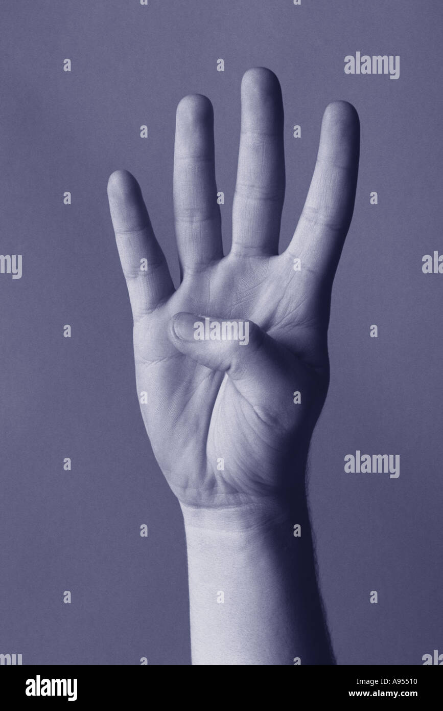 Hand showing four fingers Stock Photo Alamy