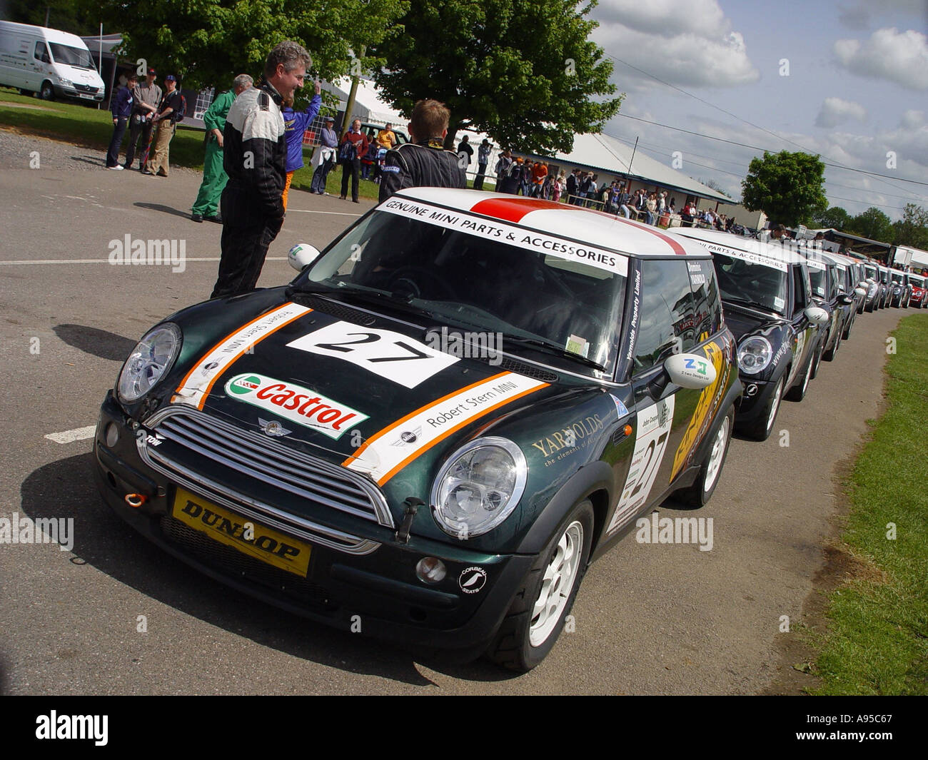 Minis lining up waiting to be called on to the motor racing circuit near the village of Castle Combe Wiltshire England GB UK 2003 Stock Photo