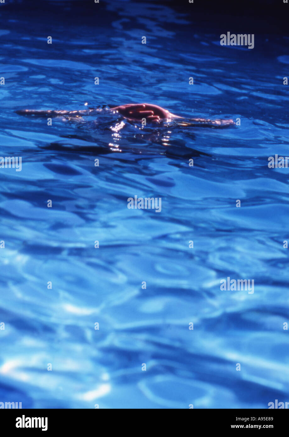 Small pair of hands on top of water Stock Photo