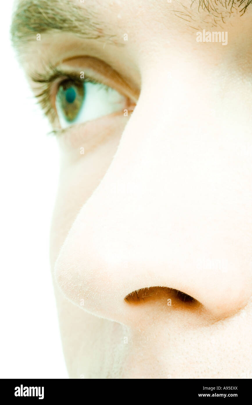 Young man's face, extreme close-up, cropped view Stock Photo