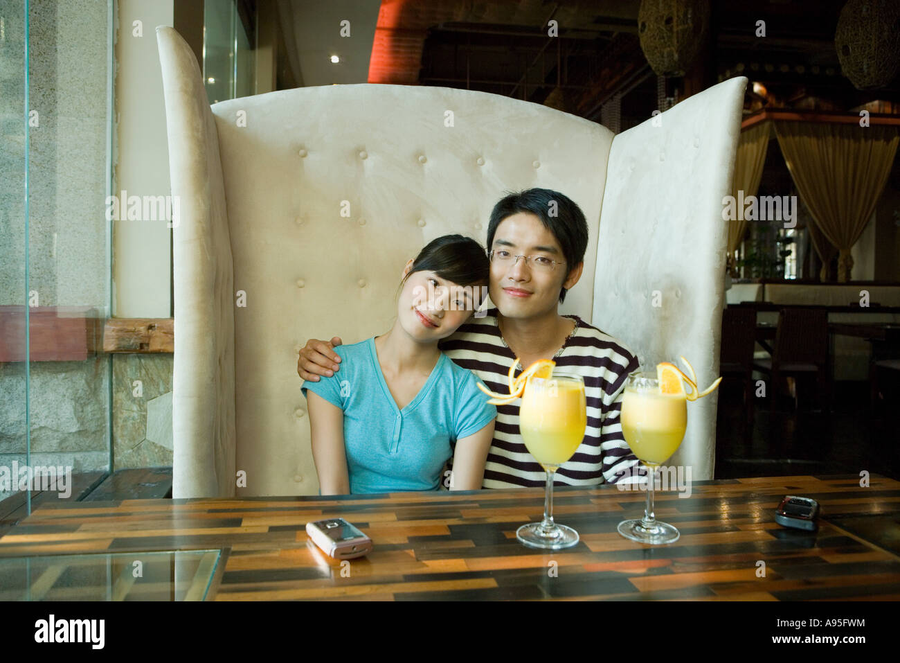 Couple sitting in restaurant booth hires stock photography and images