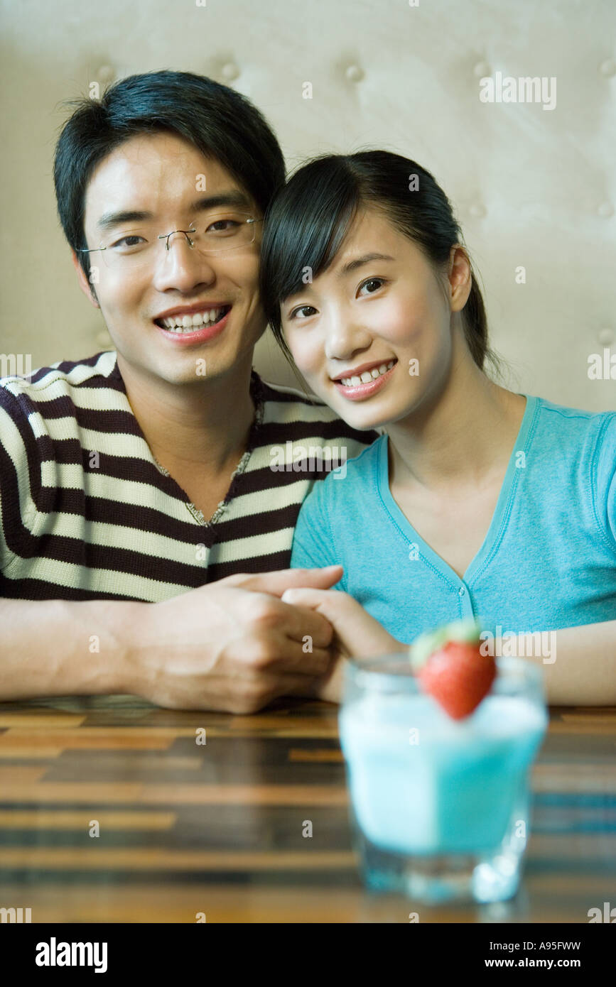 Couple sitting in restaurant booth hires stock photography and images