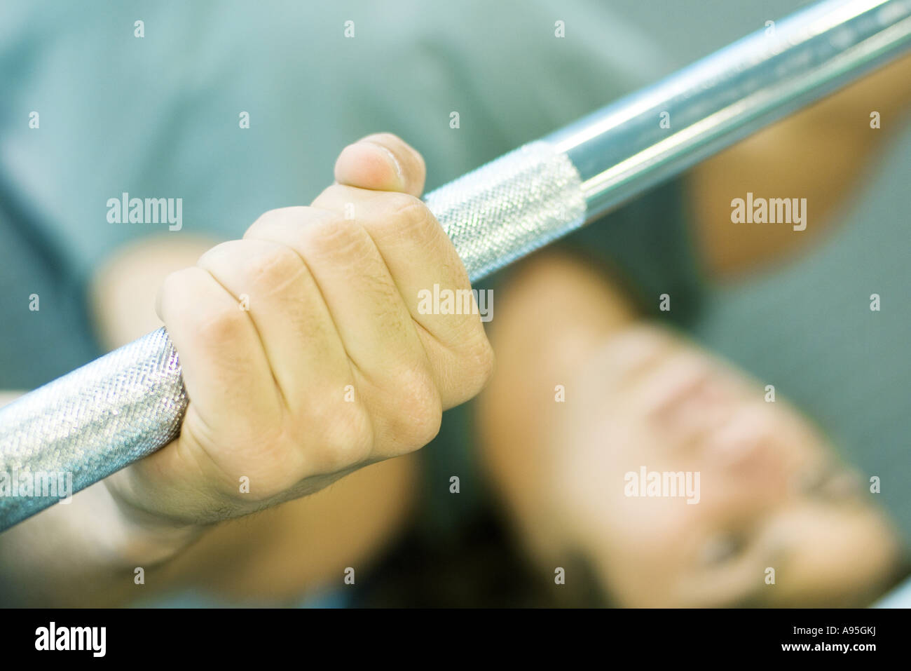 Man lifting barbell Stock Photo