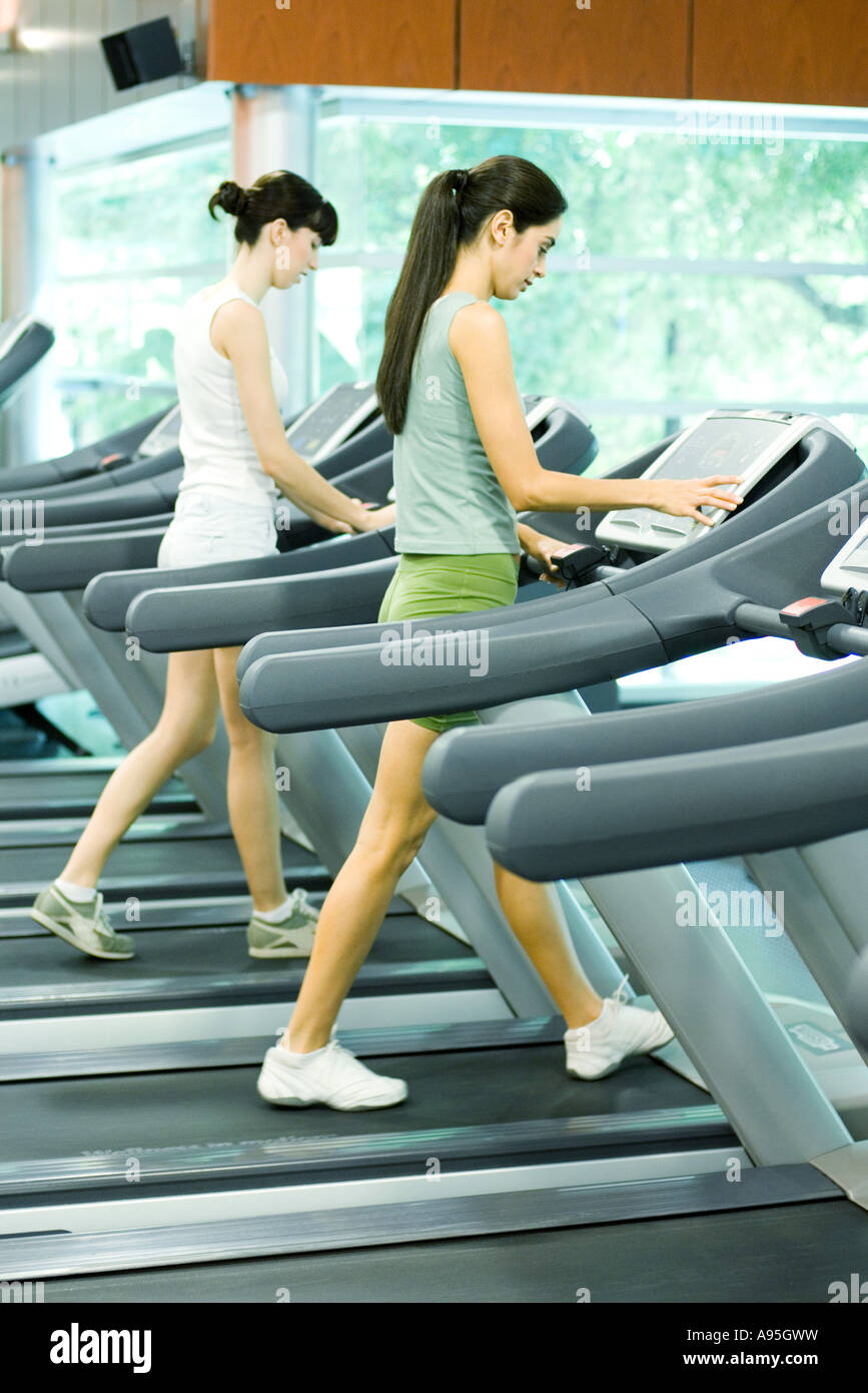 Two women walking on treadmills Stock Photo