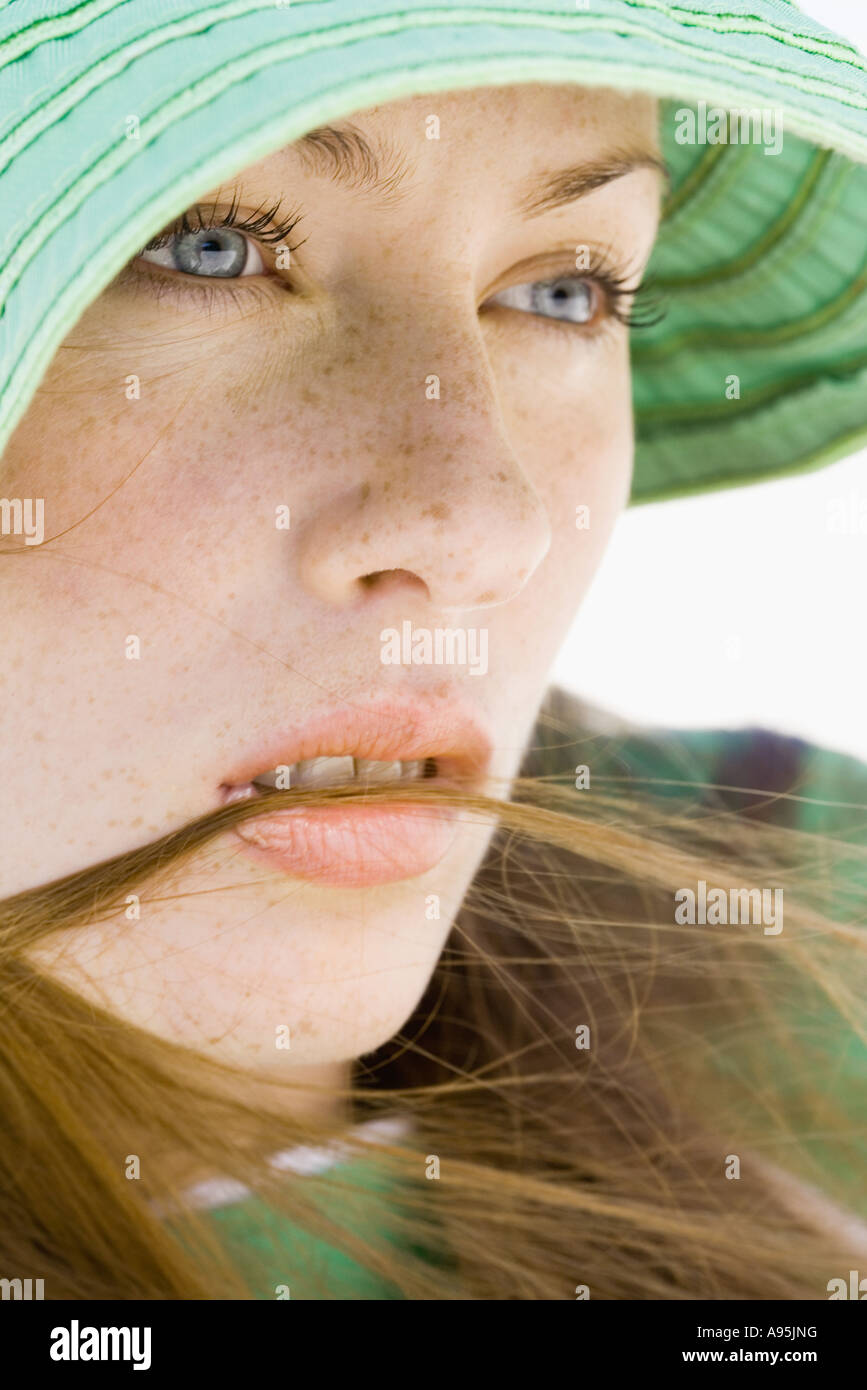 Young woman wearing sun hat, close-up Stock Photo