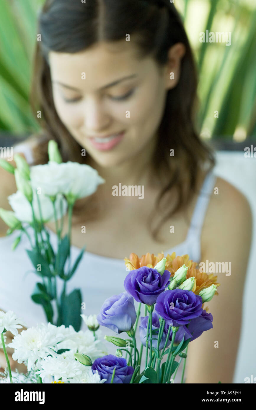Young woman making fresh flower arrangement Stock Photo - Alamy