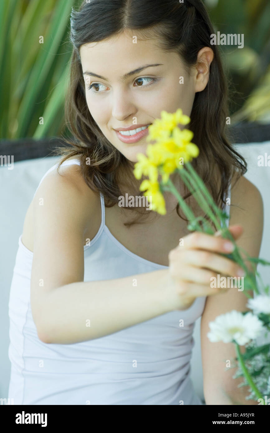 Young woman making fresh flower arrangement Stock Photo - Alamy