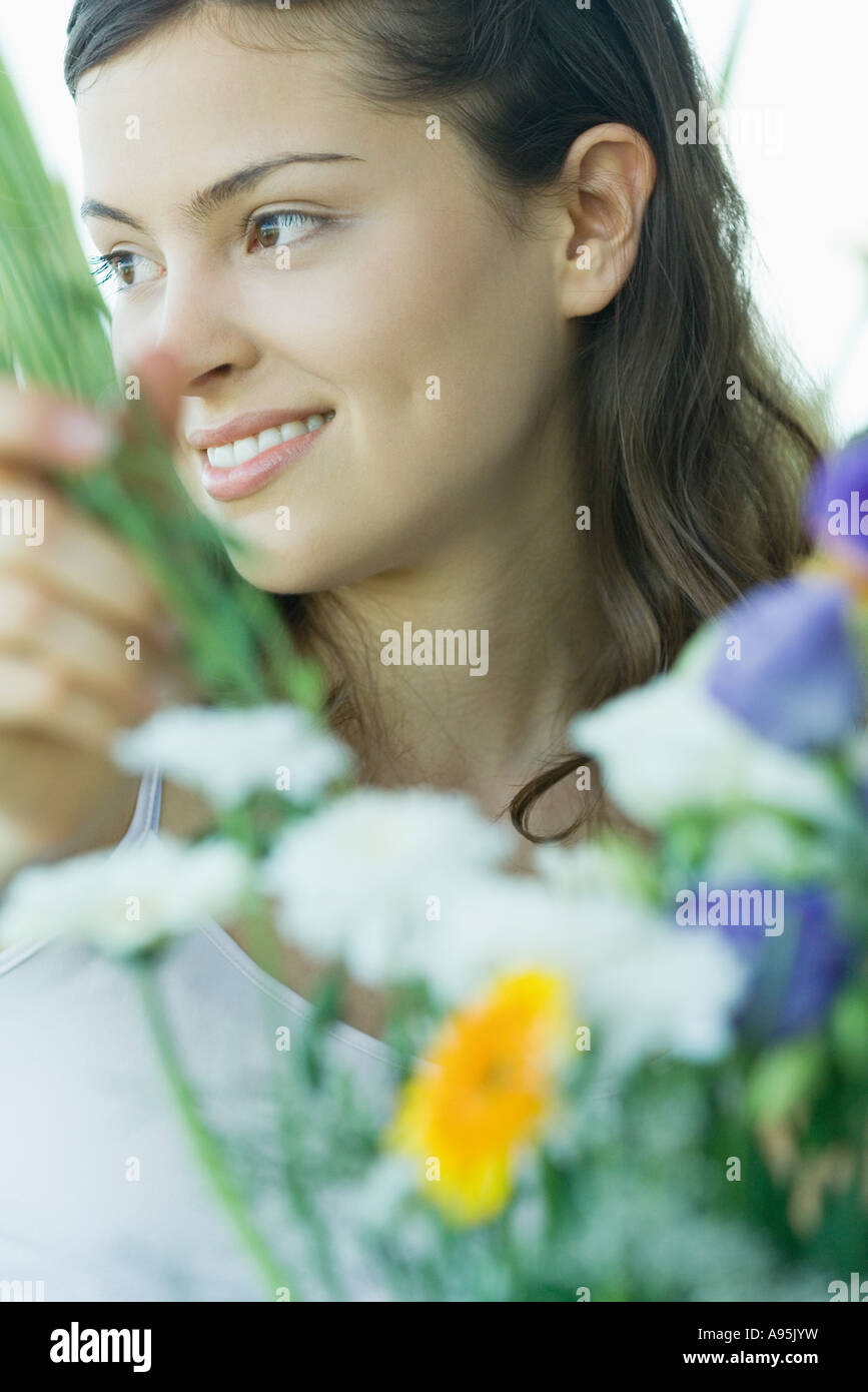 Young woman making fresh flower arrangement Stock Photo - Alamy