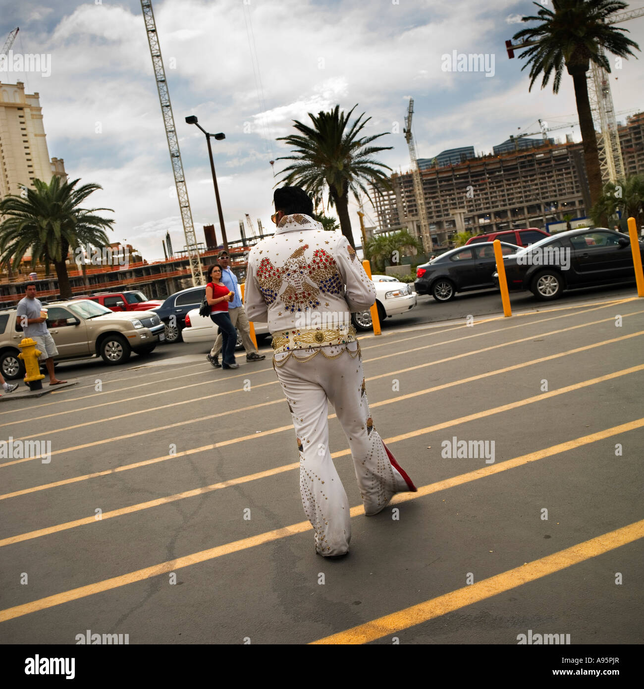 leaving Las Vegas Elvis impersonator no model release required: Back view of man in ubiquitous costume so unrecognizable Stock Photo