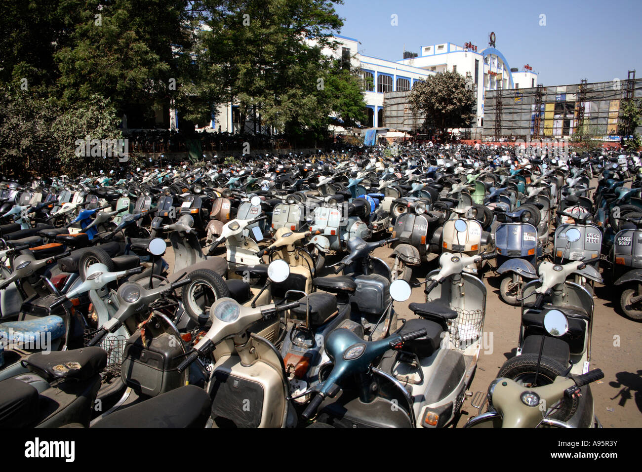 Full scooter park outside railway station, Vadodara, Gujarat, India Stock Photo