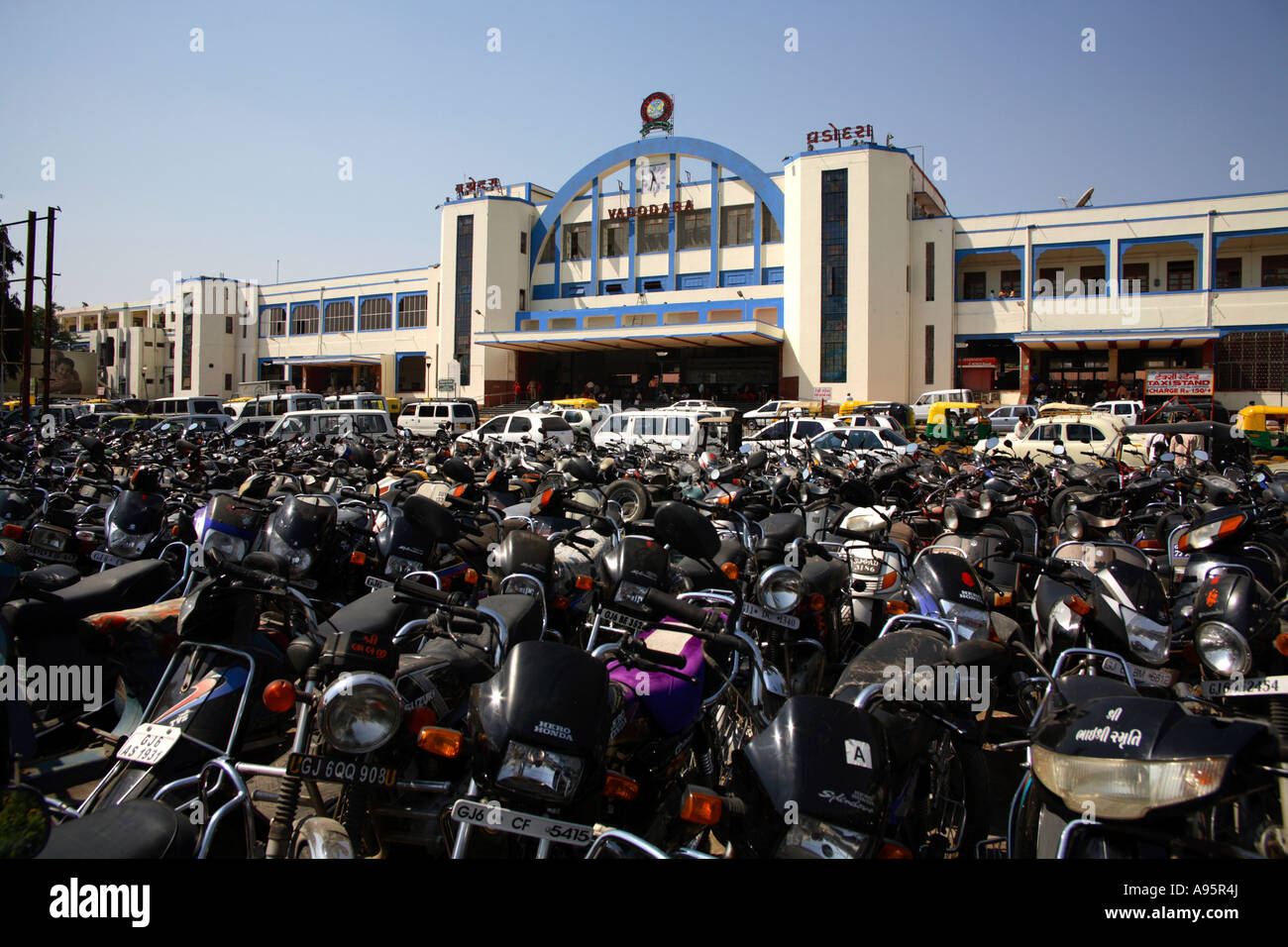 Full scooter park outside railway station, Vadodara, Gujarat, India Stock Photo