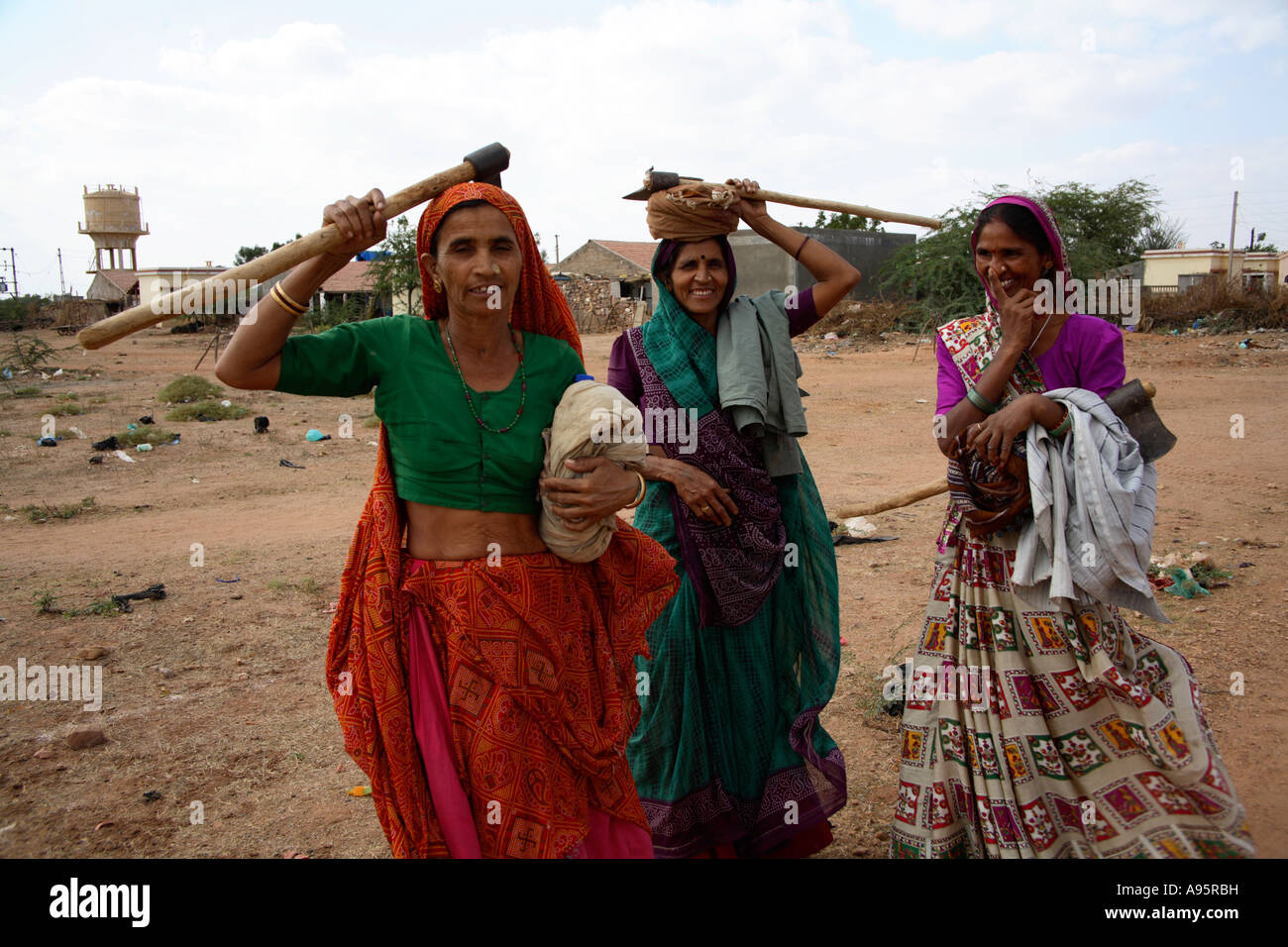 Three female wood cutters posing for camera outside Hiralaxmi Memorial Craft Park, Bhujodi Village, Kutch, Gujarat, India Stock Photo