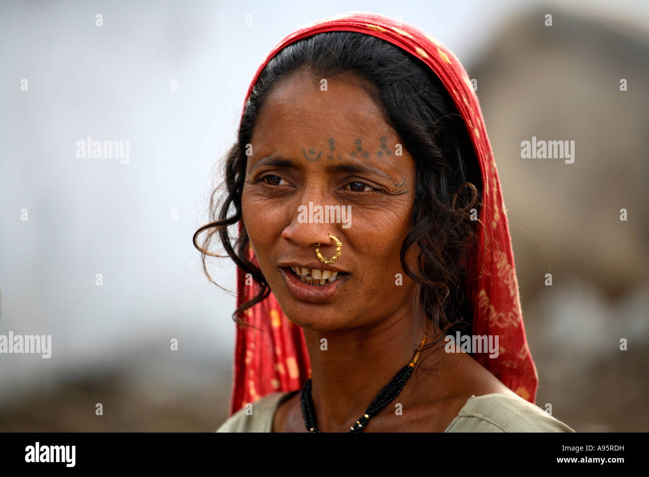 Tribal woman from Kutch district at bus-stand, Bhuj, Gujarat, India Stock Photo