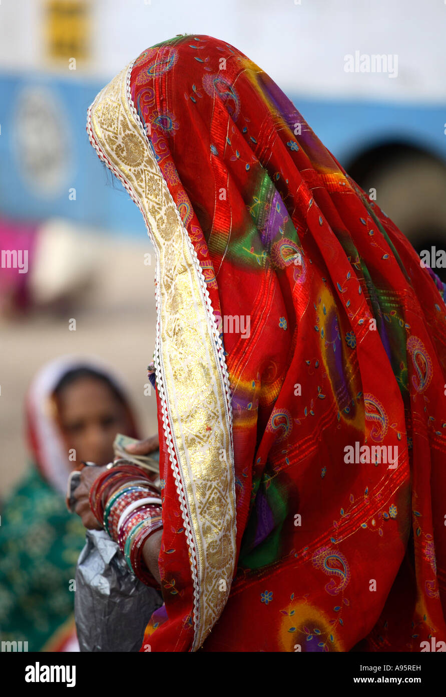 Decorative veil on Tribal Indian woman from Kutch district at bus-stand, Bhuj, Gujarat, India Stock Photo