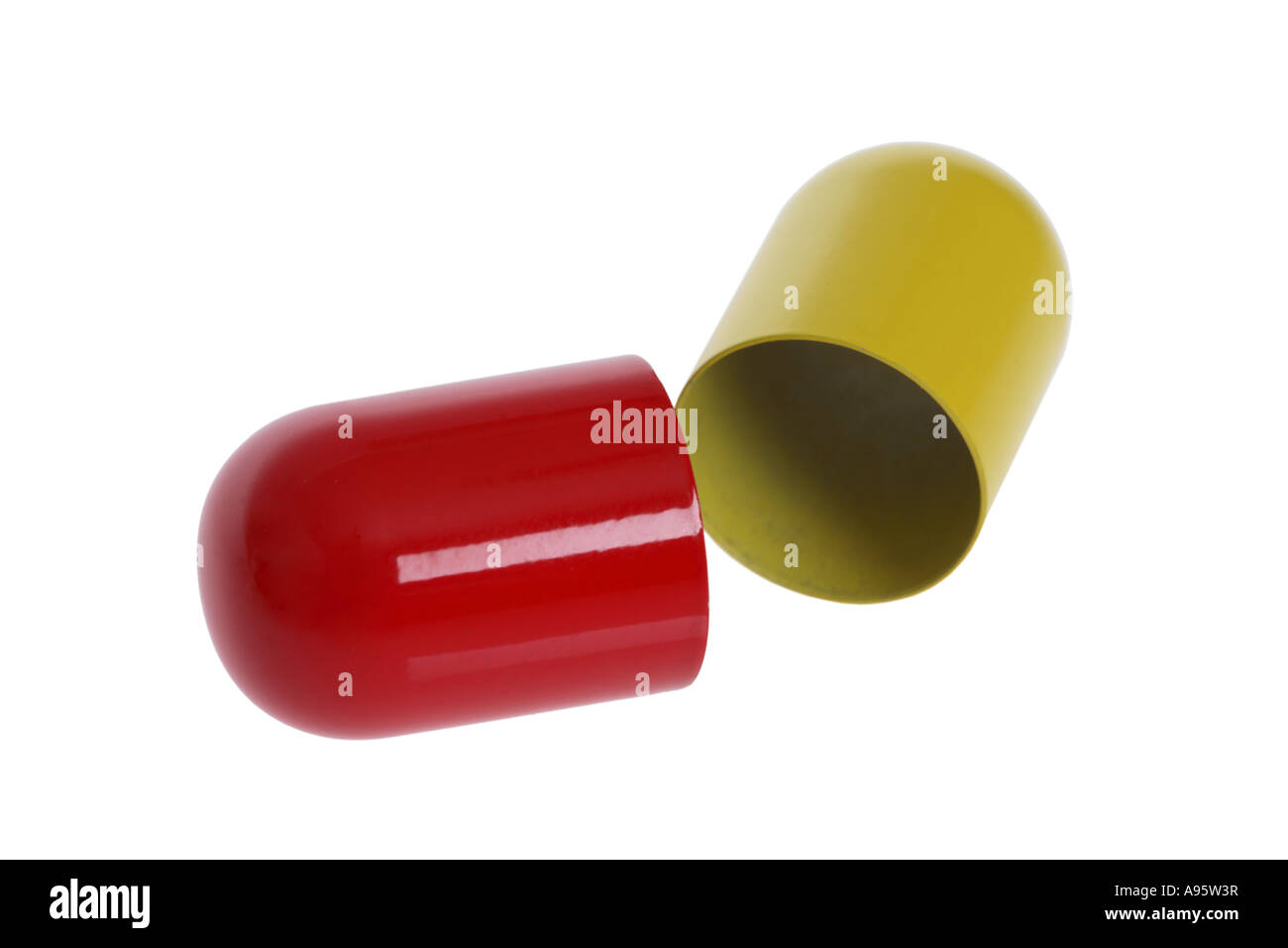 Open Pill Capsule cut out on white background Stock Photo