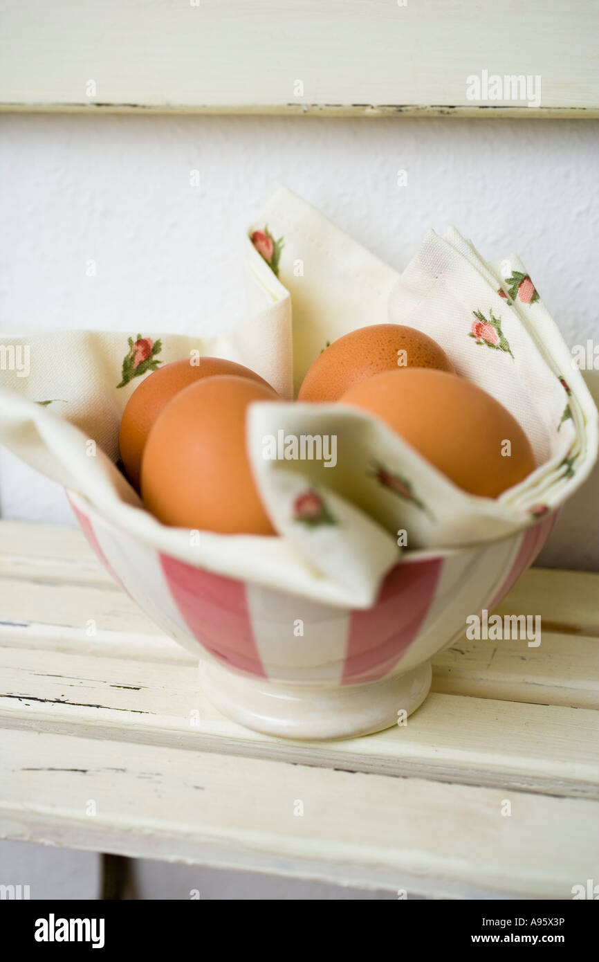 Eggs in a bowl with textile napkin Stock Photo