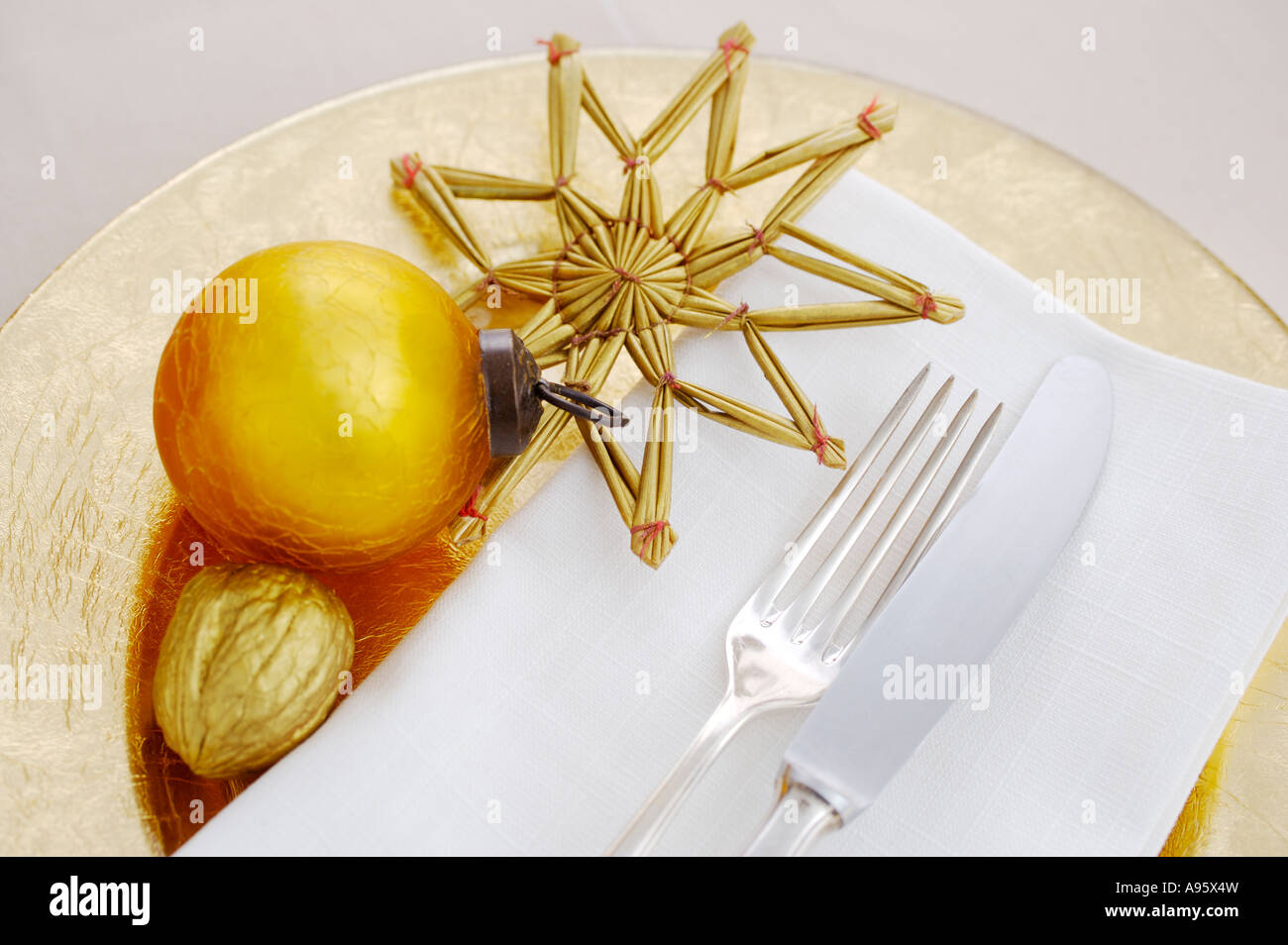 Table setting with golden Christmas decoration Stock Photo