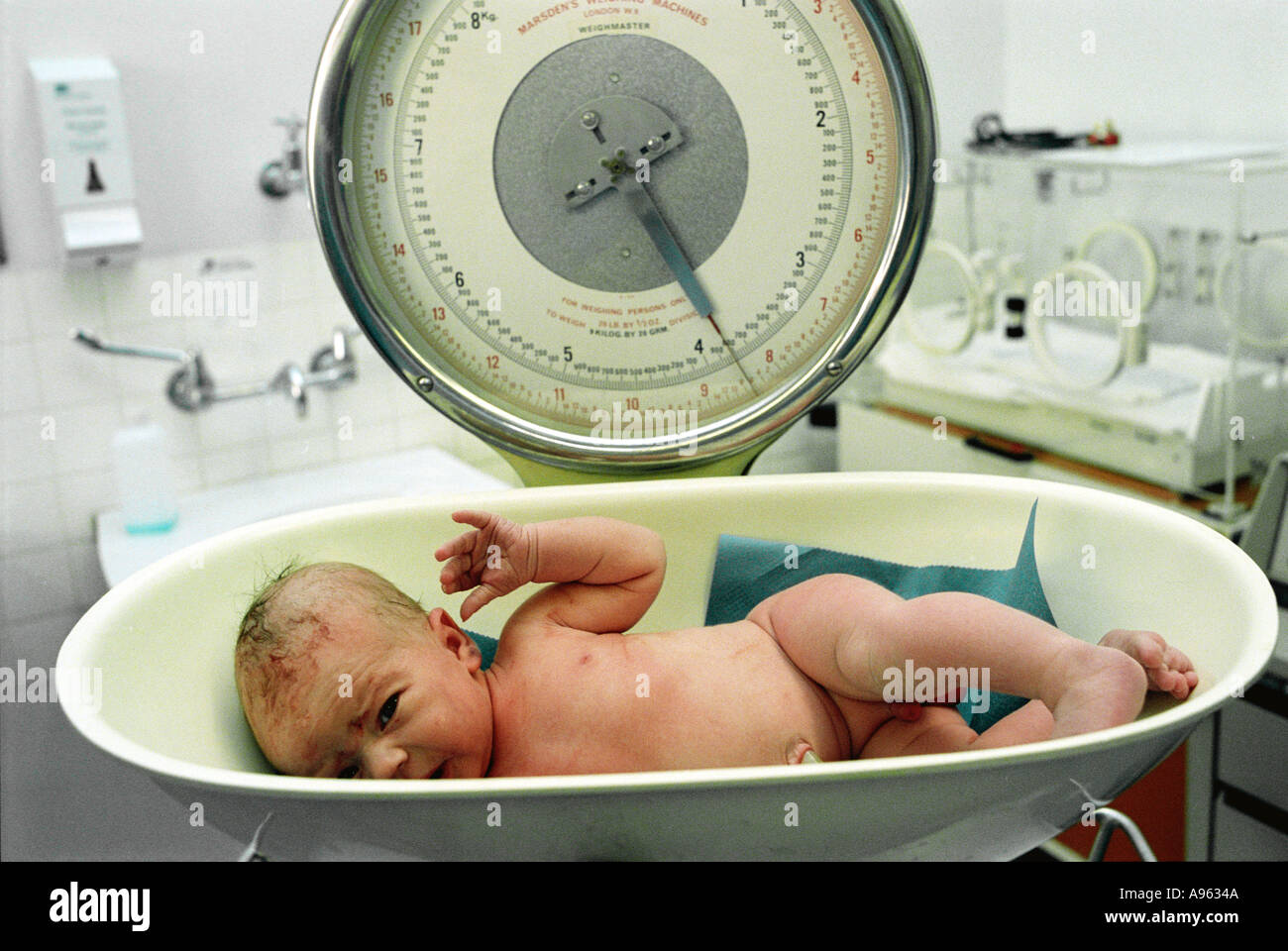 Baby being weighed hires stock photography and images Alamy
