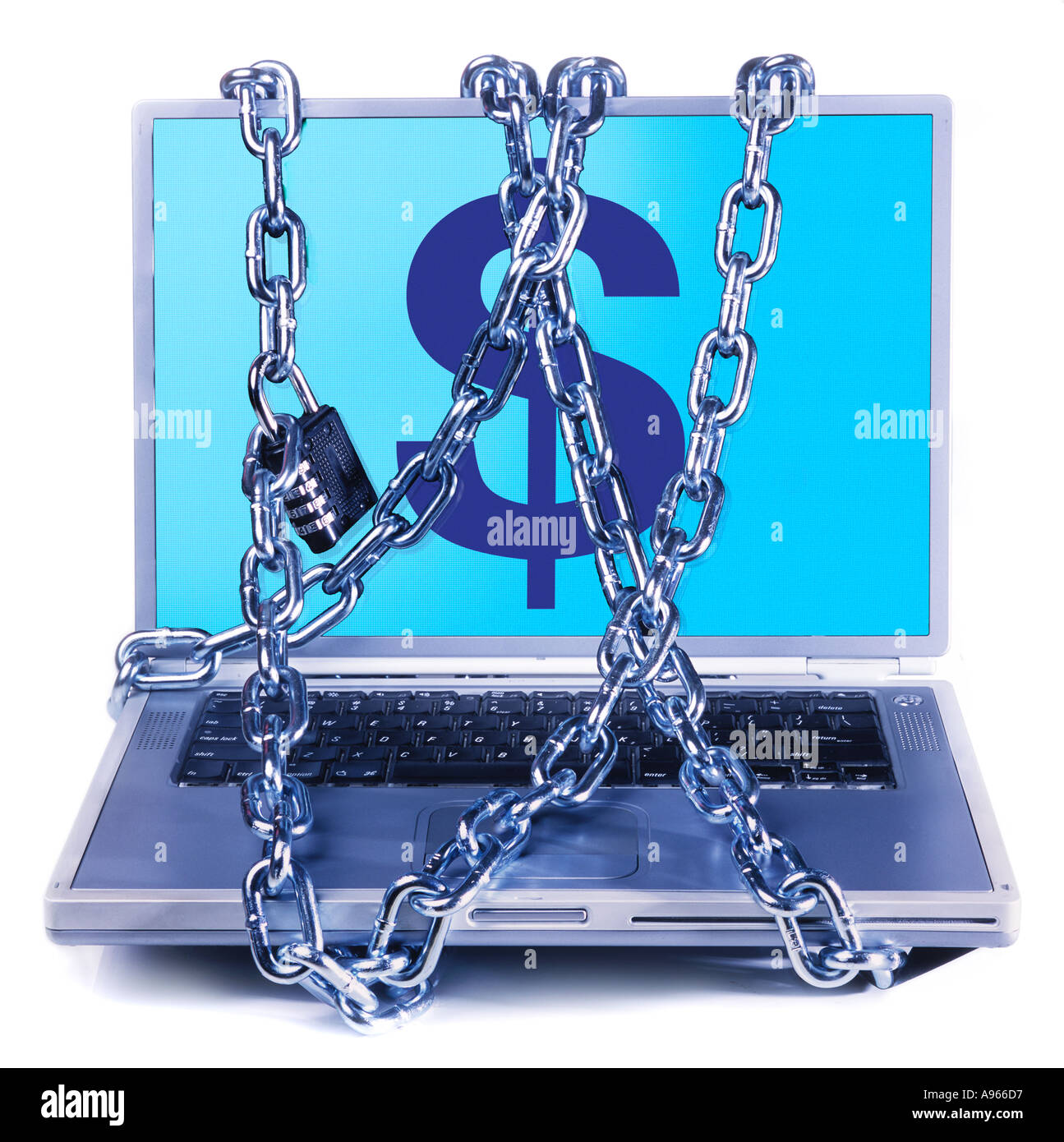 Chains wrapped around laptop depicting currency symbols Stock Photo