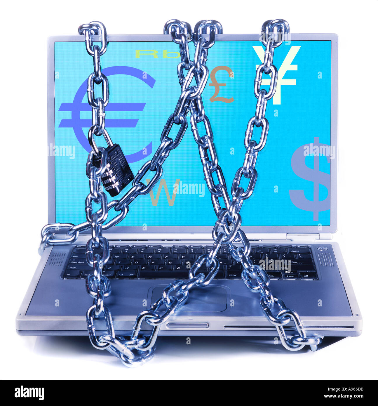 Chains wrapped around laptop depicting currency symbols Stock Photo