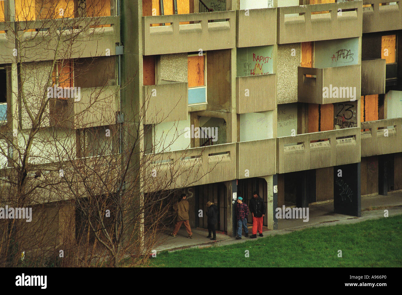 Drug dealing UK run down council estate high rise  apartment block Moss Side near Manchester England. Youths dealing in drugs 1990s 1993 HOMER SYKES Stock Photo