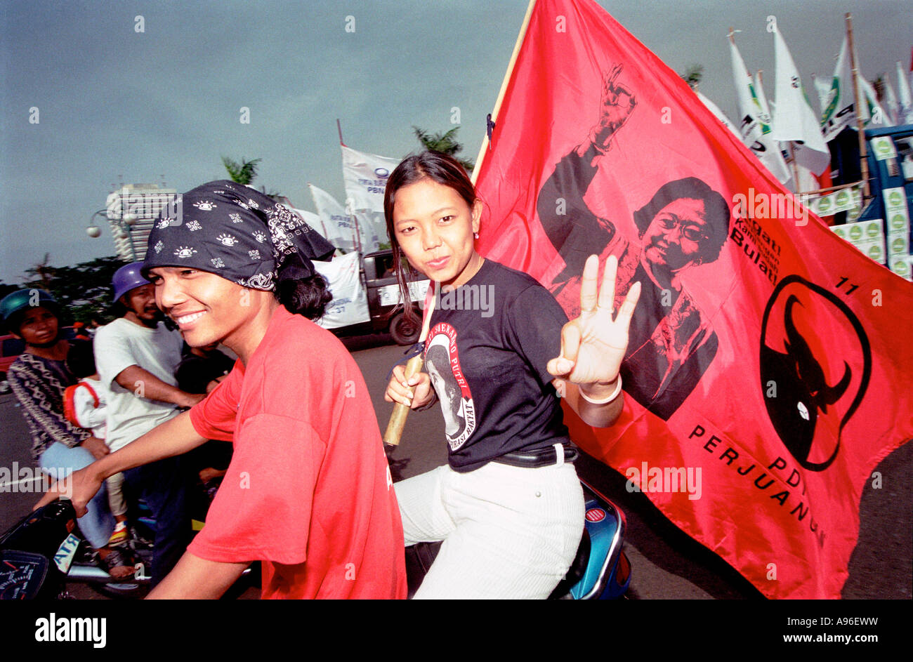 Jakarta youth ride around Jakarta showing their support for the P D I political party Stock Photo