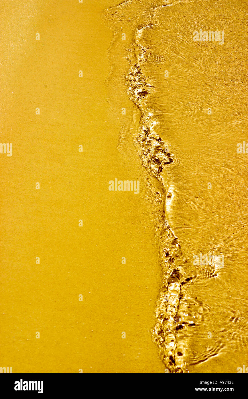 Tide on yellow sand Stock Photo Alamy