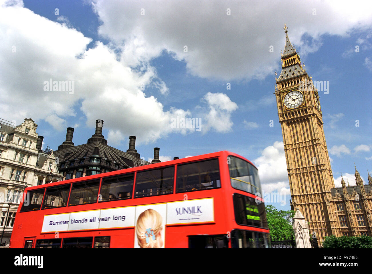 A London Bus Passes Big Ben And The Houses Of Parliament London England Stock Photo Alamy