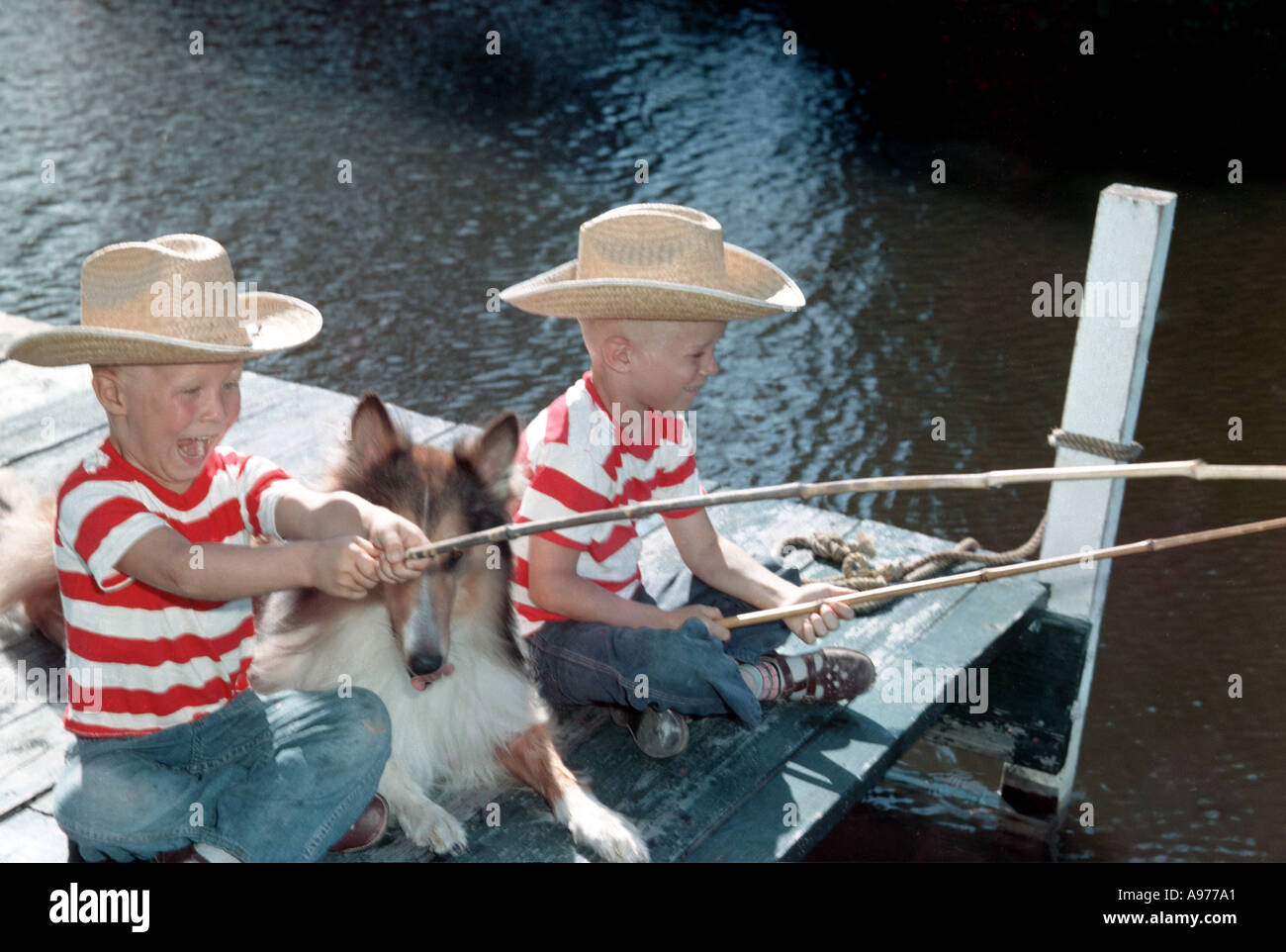 Two boys fishing at dock hi-res stock photography and images - Alamy
