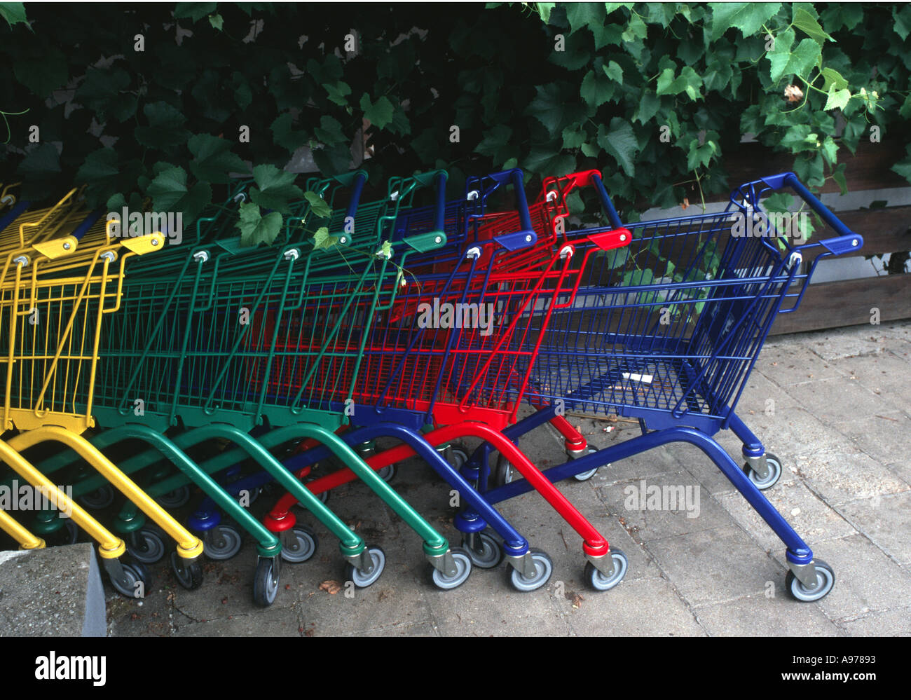 Colourful shopping trolley in Germany Stock Photo Alamy