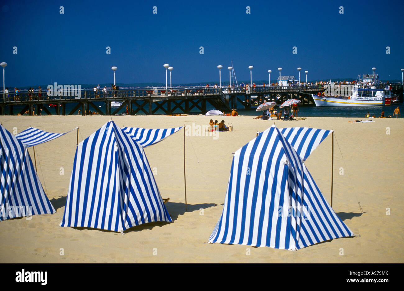 Arcachon Aquitaine France Seafront Jetee Thier Pleasure Boats and Bathers and Beach Tents Stock Photo