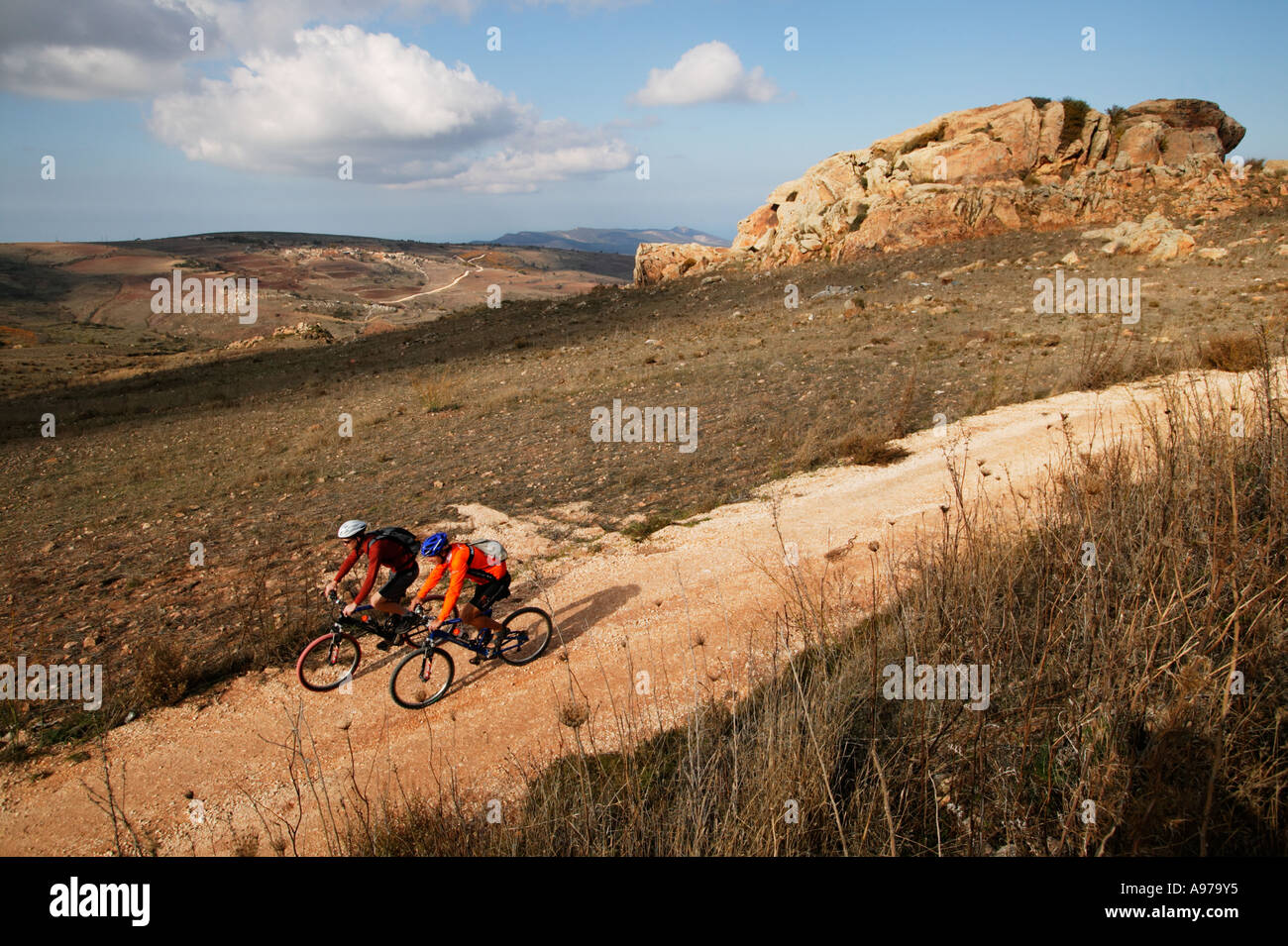 Mountain bike riders on a rural road in Cyprus Stock Photo Alamy
