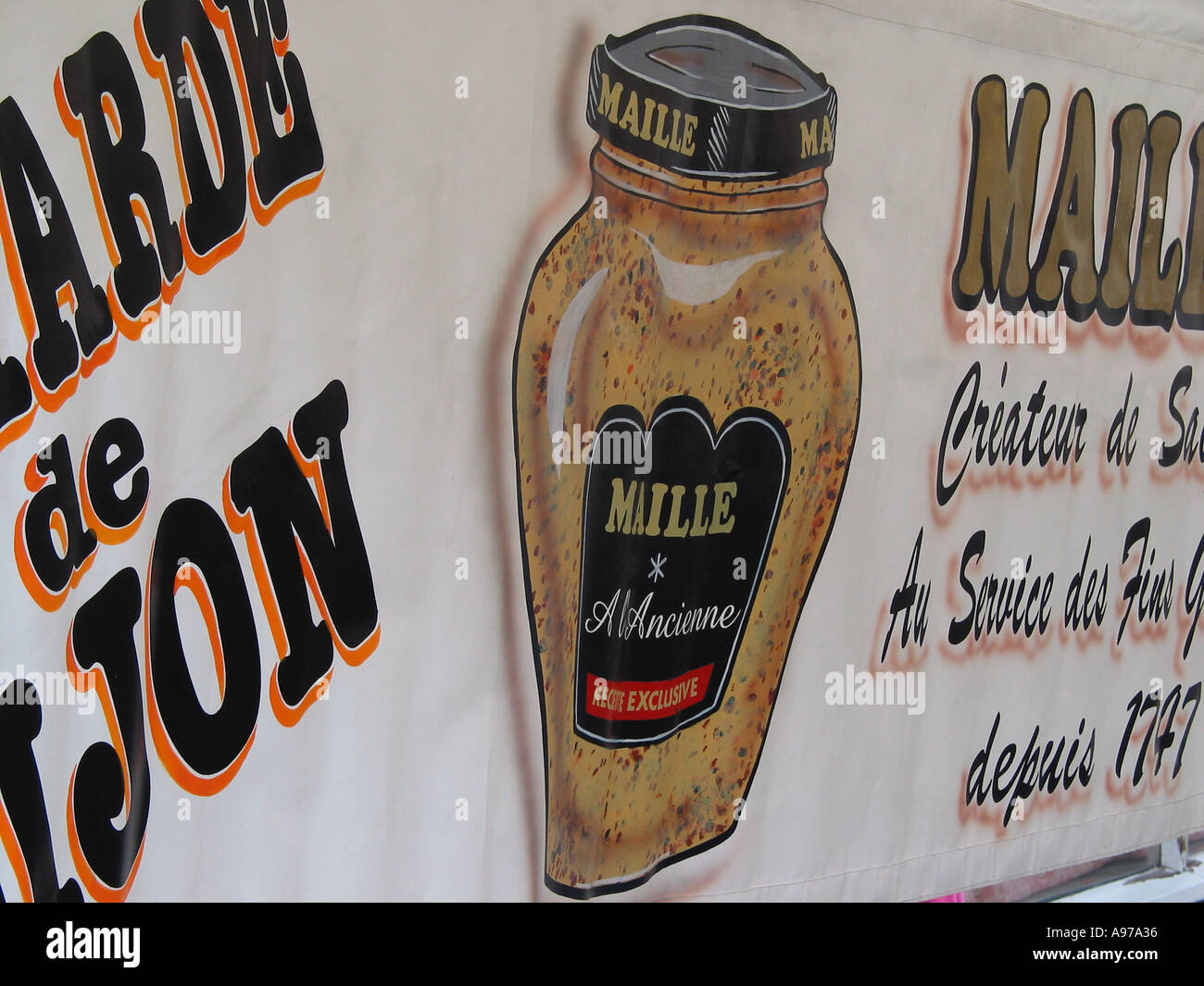 French Dijon mustard brand Maille displayed at a French market stall