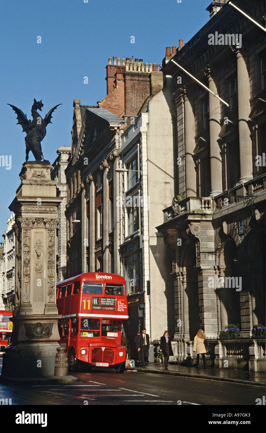 GREAT BRITAIN London Temple Bar bronze griffin Strand Marks boundary City of London Double decker bus Stock Photo