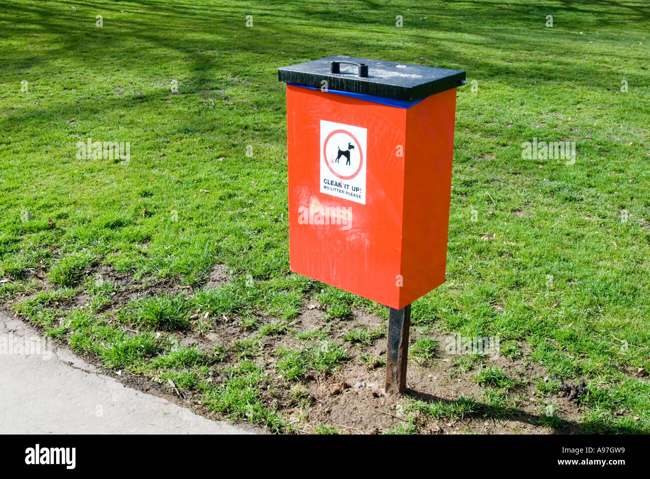 Clean it Up Dog Poo Bin in Municipal Park Stock Photo Alamy