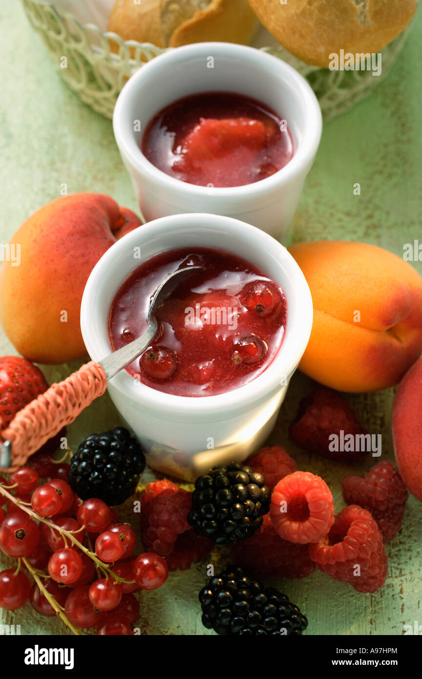 mixed-fruit-jam-in-small-bowl-surrounded-by-fresh-fruit-foodcollection