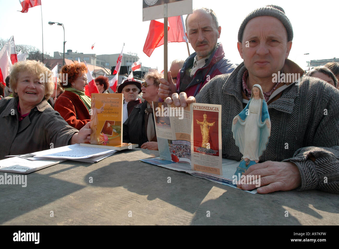Man holding Virgin Mary statue during mass before anti-abortion demonstration  in Warsaw, Poland Stock Photo
