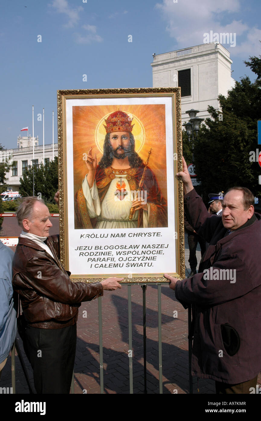 Man holding portrait of Jesus Christ Anti-abortion demonstration in Warsaw Poland Stock Photo